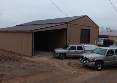 Two cars parked in front of the garage